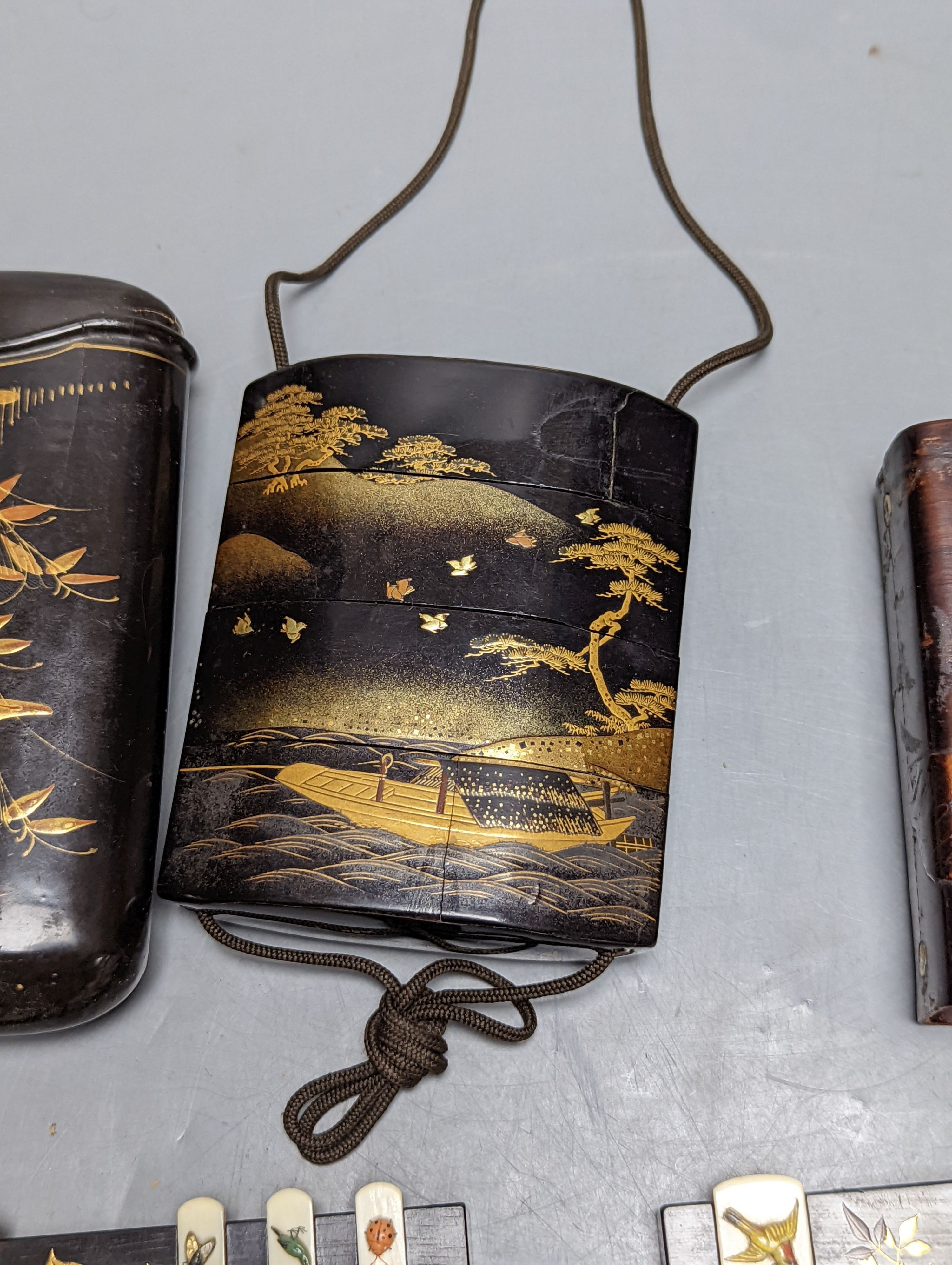 A 19th century Japanese lacquer inro, similar cigar case, two bezique markers and a birch bark case, 9 cams high.